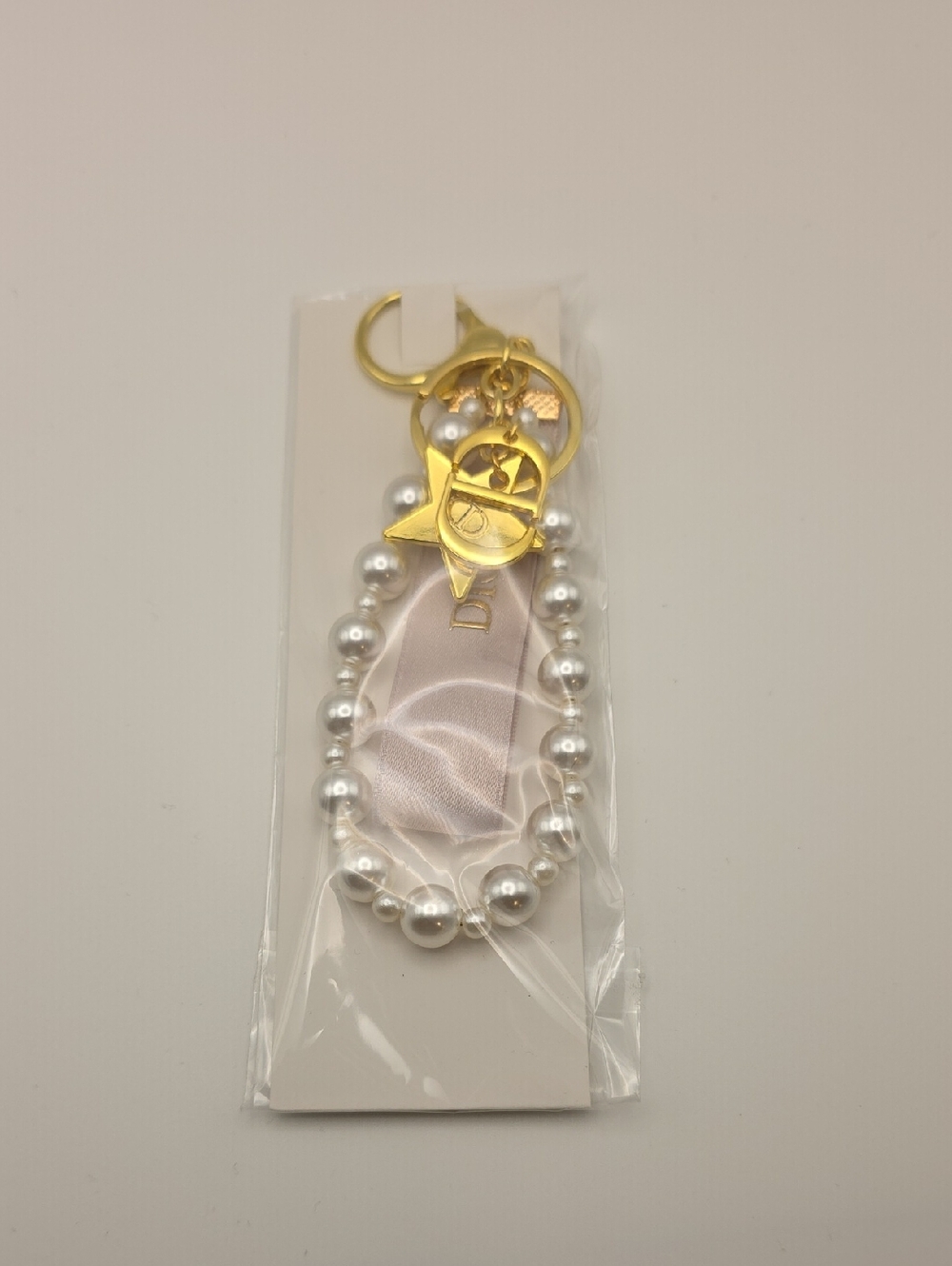 GWP Gold-Tone Pearl Keyring with Blush Ribbon